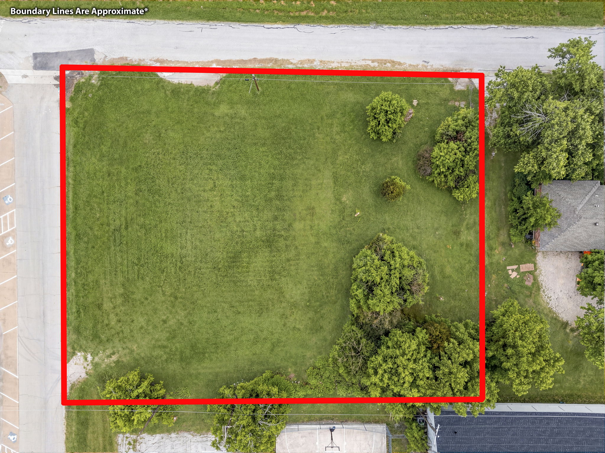 Direct overhead drone shot with red boundary lines showing the full lot